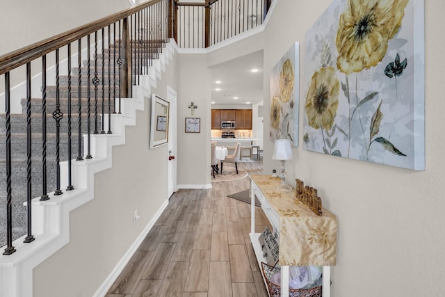 17450 Tidewater Cypress Trl, Hockley, TX 77447 - foyer with wood finished floors, baseboards, stairway, recessed lighting, and a towering ceiling