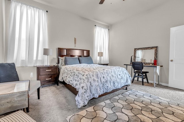 carpeted bedroom featuring ceiling fan and baseboards