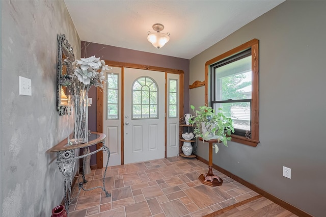 entrance foyer featuring baseboards