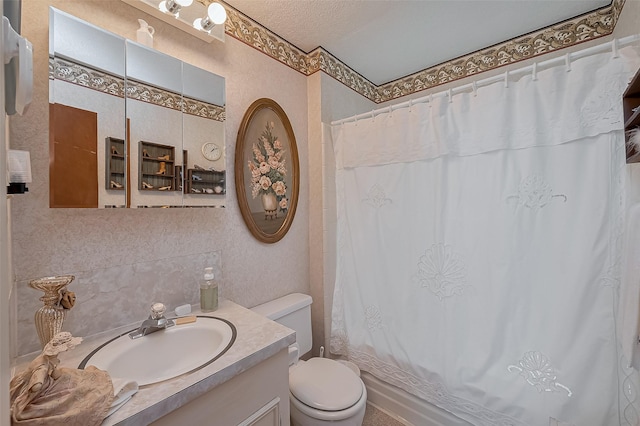 bathroom featuring shower / bath combination with curtain, toilet, and vanity