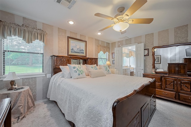 bedroom with light carpet, baseboards, visible vents, and wallpapered walls
