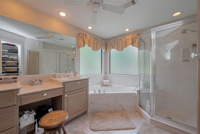 full bathroom with visible vents, a ceiling fan, a stall shower, and vanity