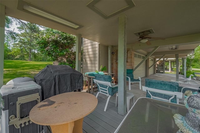 wooden terrace with a yard, outdoor dining space, area for grilling, and ceiling fan