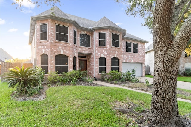 2529 La Rochelle Ct, Seabrook, TX 77586 - french country inspired facade featuring brick siding, a garage, concrete driveway, and roof with shingles