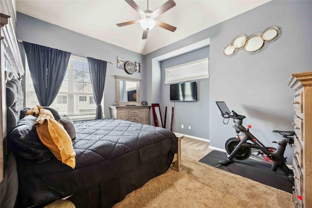 bedroom with lofted ceiling, carpet floors, a ceiling fan, and baseboards