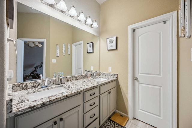 full bath with a sink and double vanity