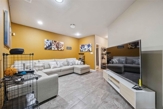 living room featuring marble finish floor and recessed lighting