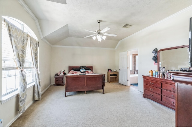 2702 Lakecrest Way Dr, Katy, TX 77493 - carpeted bedroom featuring ensuite bath, lofted ceiling, ornamental molding, and visible vents