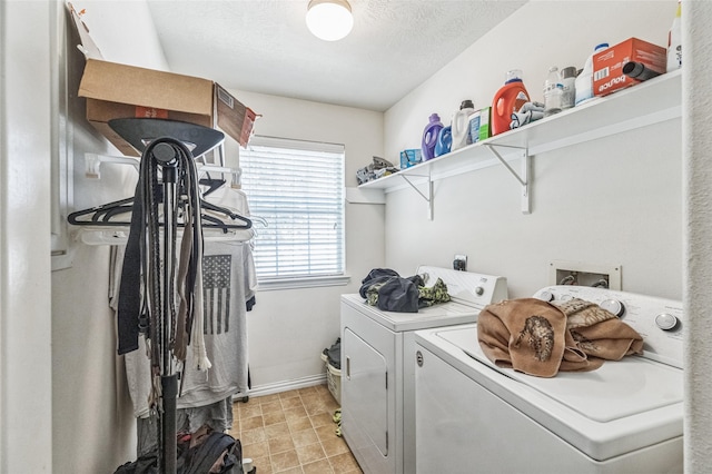 2702 Lakecrest Way Dr, Katy, TX 77493 - laundry area with a textured ceiling, washer and clothes dryer, baseboards, and laundry area