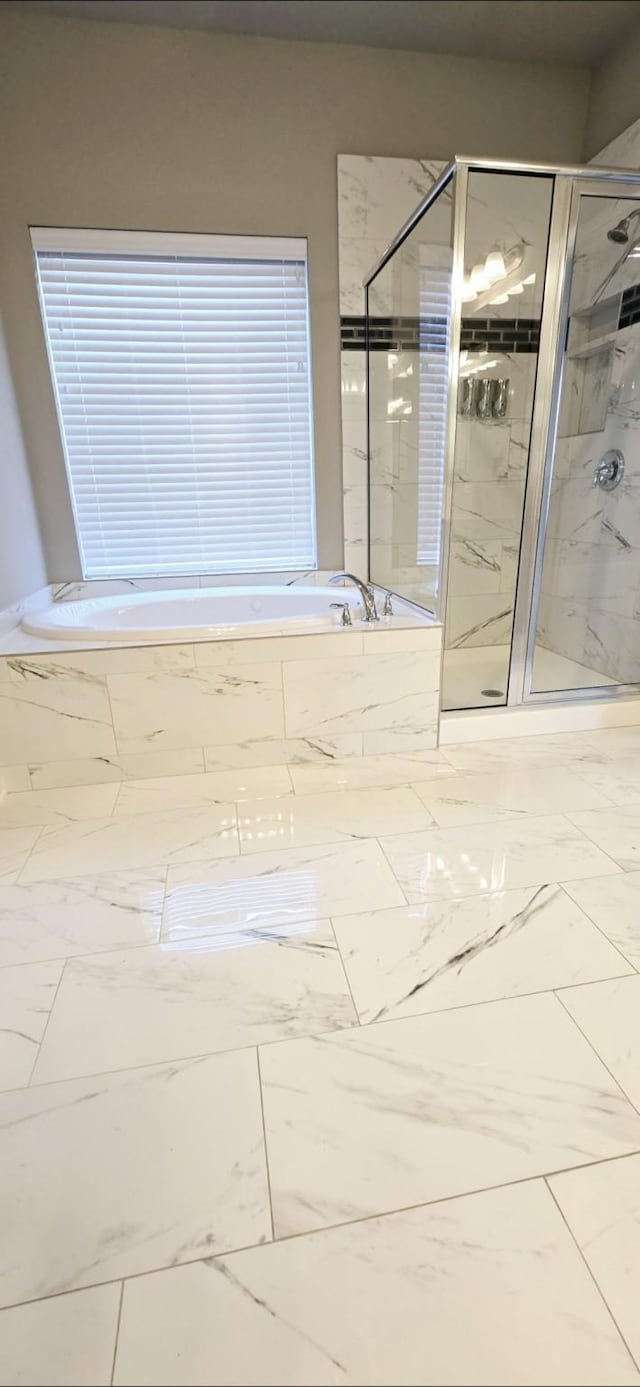 2711 Wollemi Pine Trl, Katy, TX 77493 - bathroom with a garden tub, marble finish floor, and a stall shower