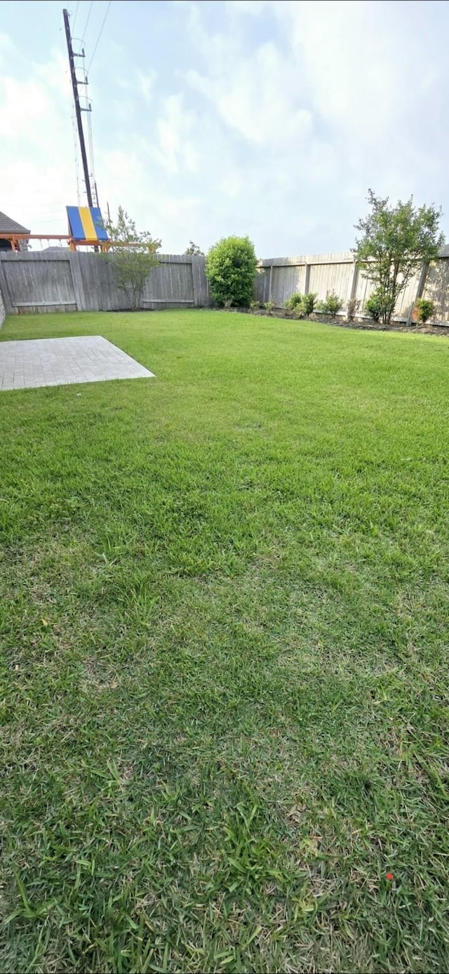 2711 Wollemi Pine Trl, Katy, TX 77493 - view of yard featuring a fenced backyard and a patio