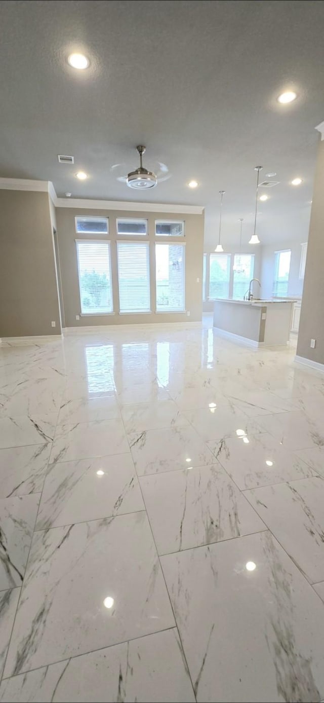 2711 Wollemi Pine Trl, Katy, TX 77493 - empty room featuring baseboards, visible vents, recessed lighting, marble finish floor, and ornamental molding