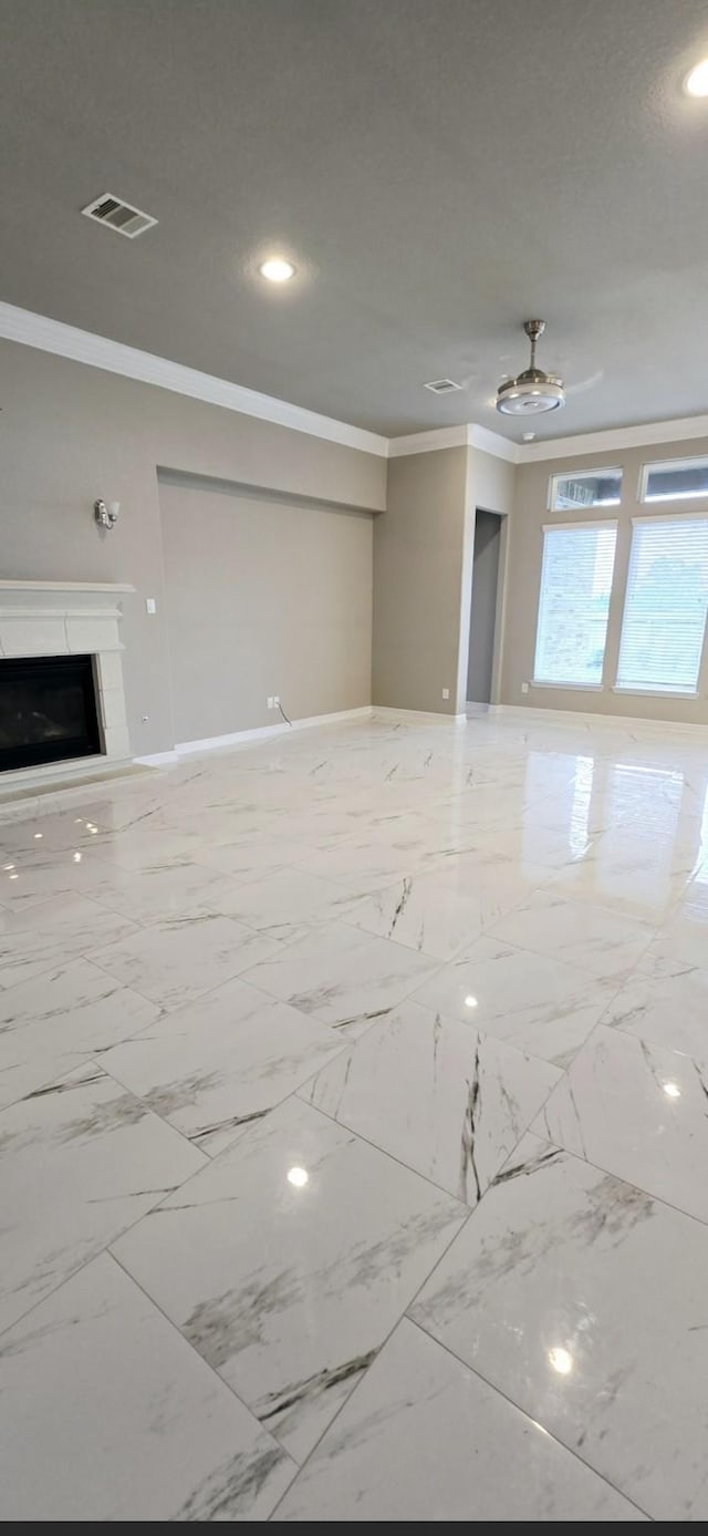 2711 Wollemi Pine Trl, Katy, TX 77493 - unfurnished living room featuring a fireplace, baseboards, ornamental molding, visible vents, and recessed lighting