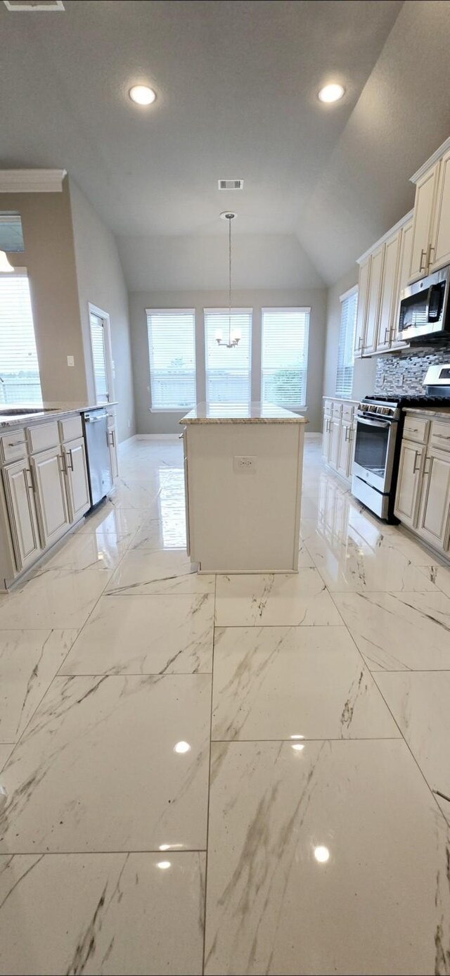 2711 Wollemi Pine Trl, Katy, TX 77493 - kitchen featuring recessed lighting, lofted ceiling, visible vents, a sink, and appliances with stainless steel finishes