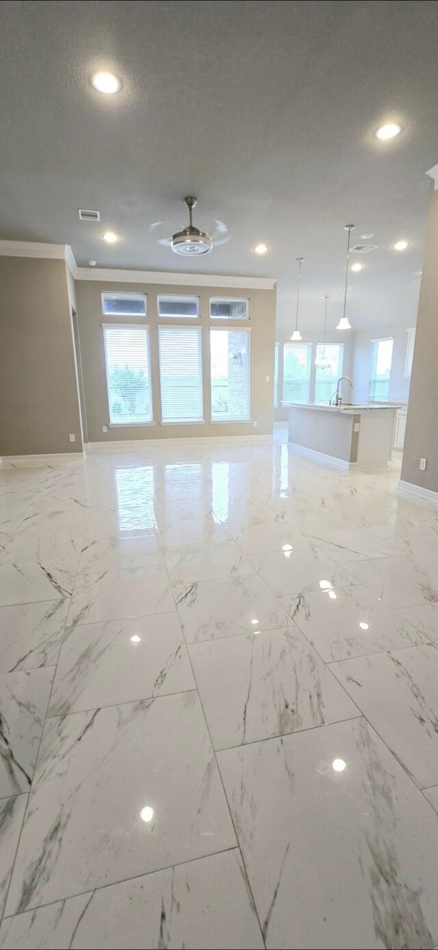 2711 Wollemi Pine Trl, Katy, TX 77493 - spare room featuring crown molding, marble finish floor, baseboards, visible vents, and recessed lighting