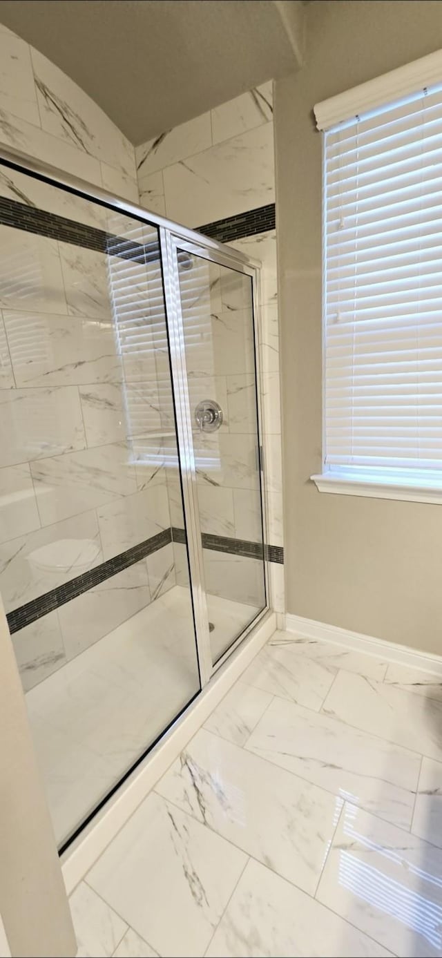 2711 Wollemi Pine Trl, Katy, TX 77493 - full bath featuring a shower stall, marble finish floor, and baseboards