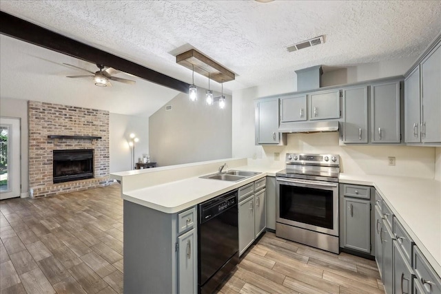 1117 Meadowland Dr, Beaumont, TX 77706 - kitchen featuring stainless steel electric stove, under cabinet range hood, visible vents, gray cabinetry, and black dishwasher
