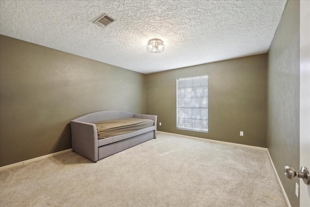 1117 Meadowland Dr, Beaumont, TX 77706 - bedroom with a textured ceiling, carpet, visible vents, and baseboards