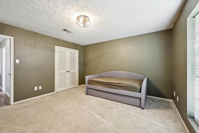 1117 Meadowland Dr, Beaumont, TX 77706 - bedroom with a closet, carpet floors, visible vents, and baseboards