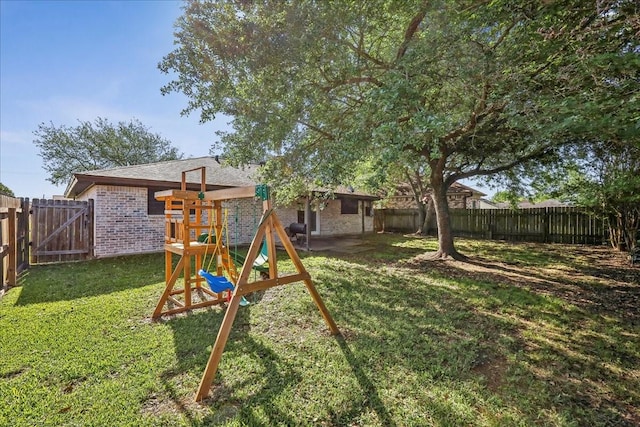 1117 Meadowland Dr, Beaumont, TX 77706 - view of yard with a fenced backyard and a playground