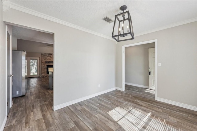 1117 Meadowland Dr, Beaumont, TX 77706 - unfurnished dining area featuring a fireplace, visible vents, baseboards, and dark wood-style flooring