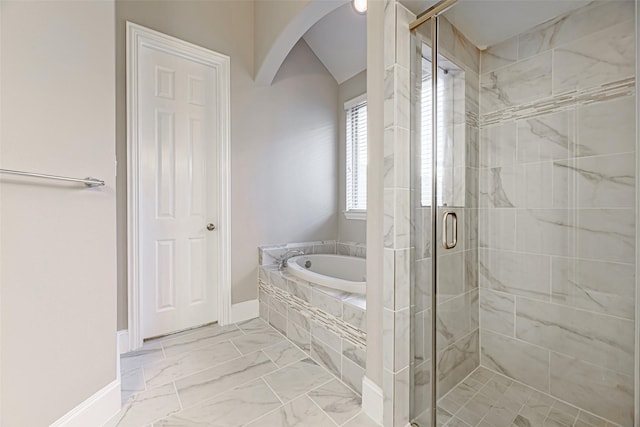 bathroom with baseboards, a garden tub, marble finish floor, and a stall shower