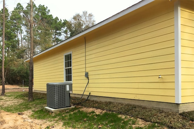 view of property exterior with central air condition unit