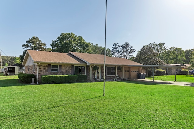 single story home with concrete driveway, an attached garage, brick siding, and a front lawn