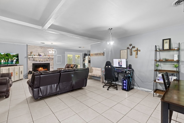 living area with light tile patterned flooring, a brick fireplace, and visible vents