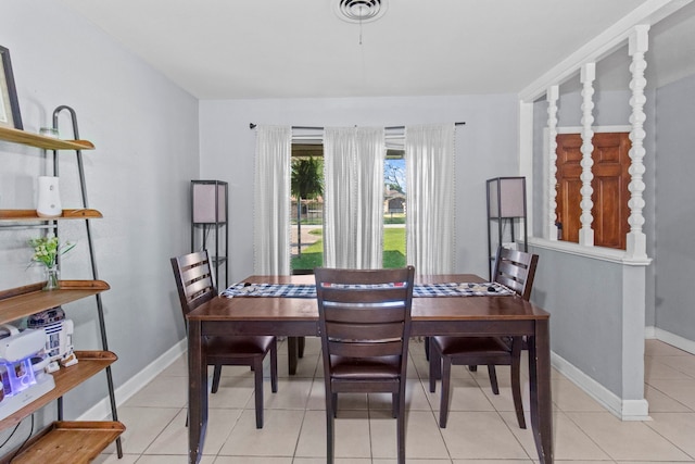 dining room featuring baseboards, visible vents, and light tile patterned flooring