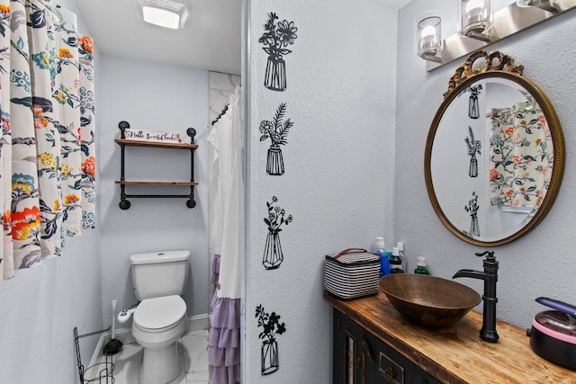 full bathroom featuring toilet and vanity