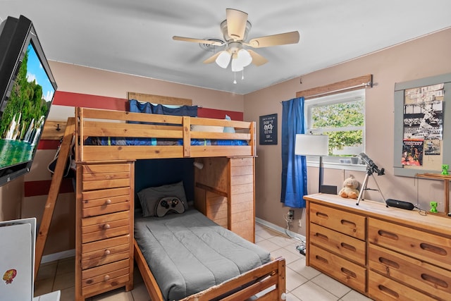 bedroom with baseboards and light tile patterned flooring