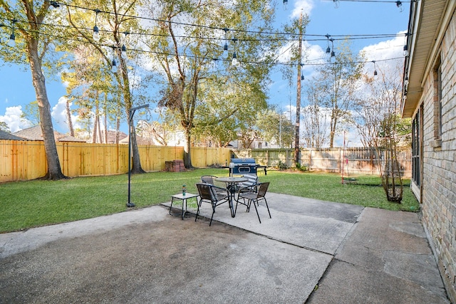 view of patio featuring a fenced backyard and a grill