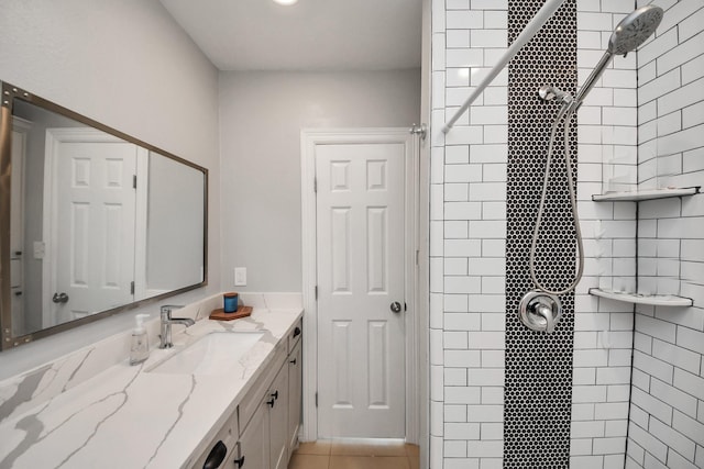 1561 Scharpe St, Houston, TX 77023 - bathroom featuring vanity, tile patterned flooring, and a tile shower