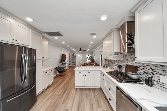 1561 Scharpe St, Houston, TX 77023 - kitchen with open floor plan, light wood-type flooring, ceiling fan, stainless steel appliances, and visible vents