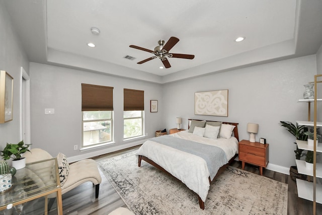 1561 Scharpe St, Houston, TX 77023 - bedroom featuring visible vents, wood finished floors, a tray ceiling, and recessed lighting