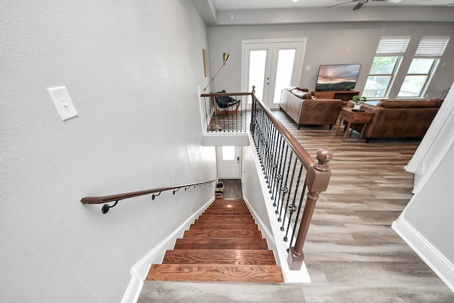 1561 Scharpe St, Houston, TX 77023 - stairs with baseboards, french doors, wood finished floors, and ceiling fan