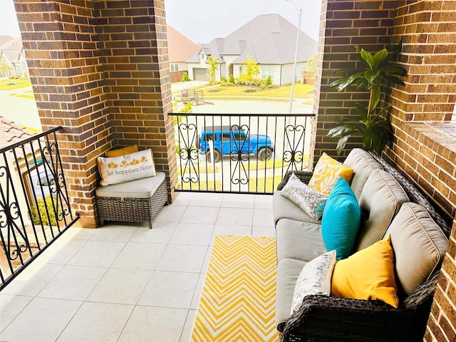 balcony featuring a residential view and an outdoor living space