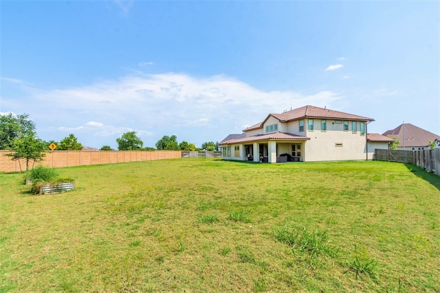 view of yard with a fenced backyard