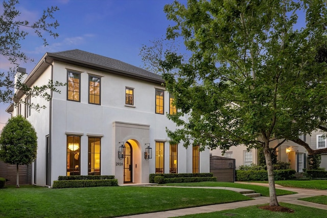 2926 Wroxton Rd, West University Place, TX 77005 - view of front facade with stucco siding and a front yard