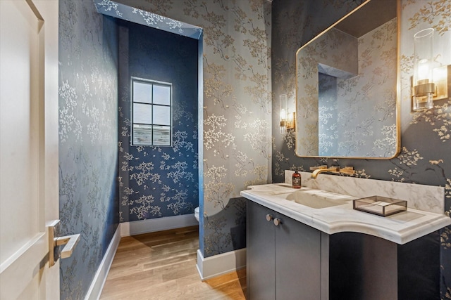 2926 Wroxton Rd, West University Place, TX 77005 - bathroom featuring wood finished floors, toilet, vanity, and baseboards