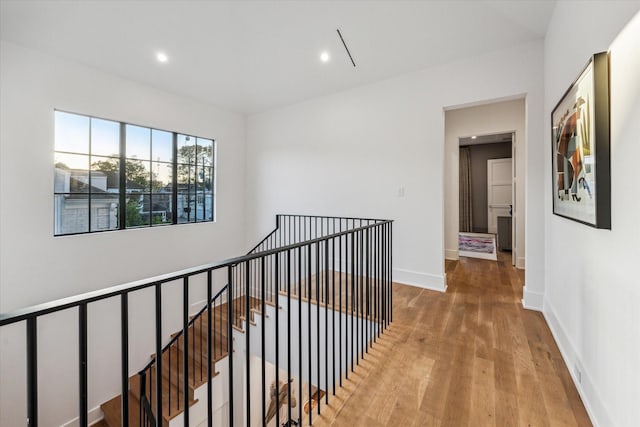 2926 Wroxton Rd, West University Place, TX 77005 - corridor with an upstairs landing, wood finished floors, recessed lighting, and baseboards