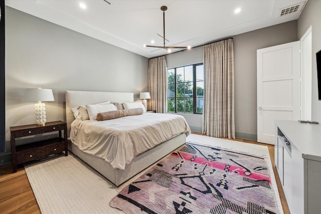 2926 Wroxton Rd, West University Place, TX 77005 - bedroom with light wood-style floors, a chandelier, recessed lighting, and baseboards