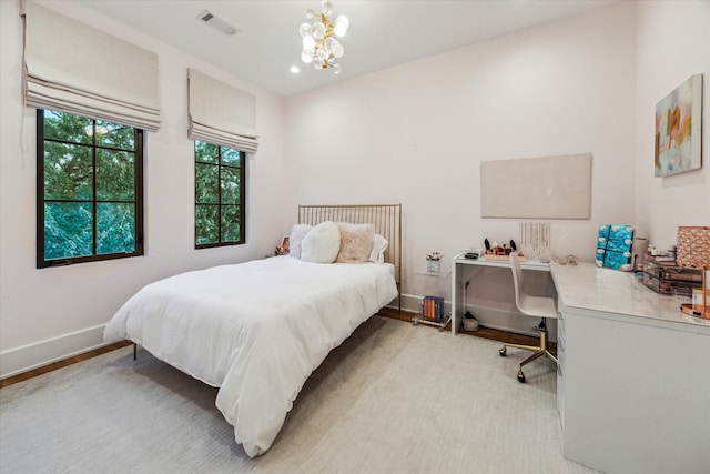 2926 Wroxton Rd, West University Place, TX 77005 - bedroom featuring light wood finished floors, a chandelier, baseboards, and an office area