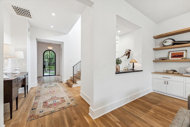 2926 Wroxton Rd, West University Place, TX 77005 - foyer entrance featuring light wood finished floors, stairway, baseboards, and recessed lighting