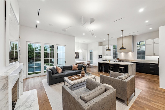 2926 Wroxton Rd, West University Place, TX 77005 - living area with healthy amount of natural light, light wood-style flooring, and recessed lighting
