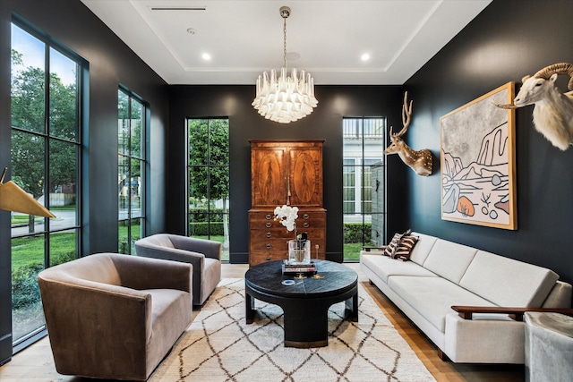 2926 Wroxton Rd, West University Place, TX 77005 - living area with a raised ceiling, a chandelier, wood finished floors, and plenty of natural light