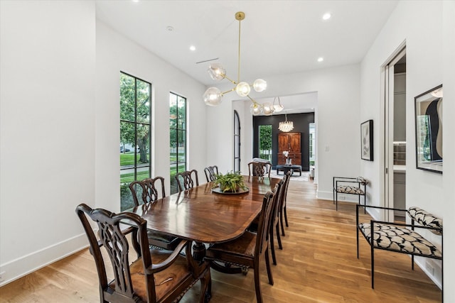 2926 Wroxton Rd, West University Place, TX 77005 - dining space with a chandelier, light wood finished floors, recessed lighting, and baseboards