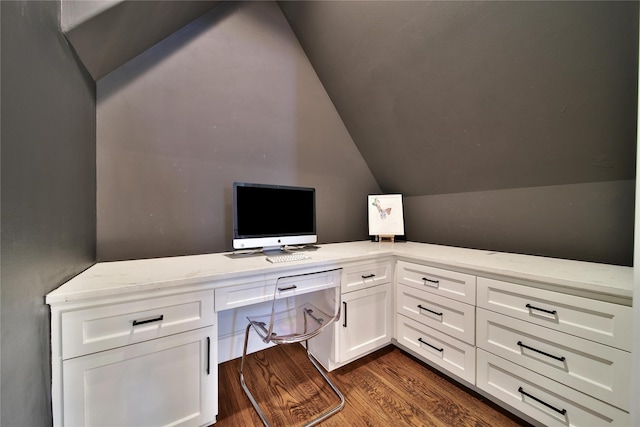 office with dark wood-style flooring, built in study area, and lofted ceiling