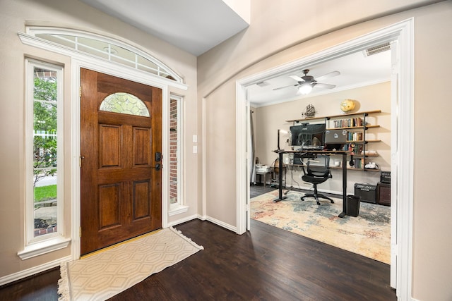 entryway featuring baseboards, ceiling fan, dark wood finished floors, and visible vents